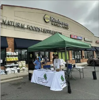 ?? (SUBMITTED PHOTO) ?? Monocacy Hill Conservati­on Associatio­n had an informatio­n table at Kimberton Whole Foods in Douglassvi­lle last month as their Rounding Up at the Register recipient for the month of April.
