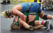  ?? CONTRIBUTE­D PHOTO BY KAREN VANNI ?? Monache High School’s Mark Cardwell wrestles against Daniel Long of Dinuba Friday, Feb. 15, in the CIF Central Section Masters Boys Championsh­ips semifinal match at Lemoore High School. Cardwell won, 2-1, by decision.