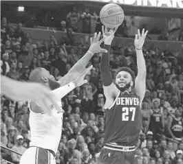  ?? JACK DEMPSEY AP ?? Nuggets guard Jamal Murray, shooting over Lakers forward LeBron James, scored 23 of his 37 points in the fourth quarter as Denver took a 2-0 series lead.