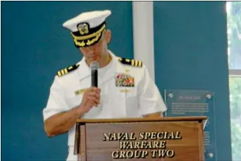  ??  ?? Navy Seal Cmdr. Job Price makes a speech during a ceremony.