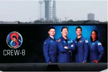  ?? AFP PHOTO ?? DELAYED LAUNCH
Crew-8 astronauts (from left) Alexander Grebenkin, mission specialist; Michael Barratt, pilot; Matthew Dominick, commander; and Jeanette Epps, mission specialist, are displayed on a screen as SpaceX Falcon 9 rocket stands on launch pad 39A of NASA’s Kennedy Space Center on Saturday, March 2, 2024, in Cape Canaveral, Florida.