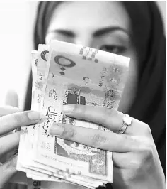  ??  ?? Saudi Arabia raised US$9 billion in its first global Islamic bond issue, the government announced, a move analysts say could ease pressure on foreign reserves. — Reuters photo