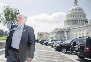  ?? Andrew Harnik Associated Press ?? SEN. BERNIE SANDERS (I-Vt.), who wants to provide healthcare for all through Medicare, arrives for a health rally outside the Capitol in Washington. Sanders will speak on the issue Friday in San Francisco.