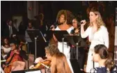  ??  ?? Soprano Takesha Meshé Kizart ( from left), Athanette Marshbanks and mezzo- soprano Sarah Ponder perform Sunday at the Concert For Peace.