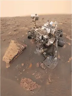  ?? NASA / JPL-CALTECH VIA THE ASSOCIATED PRESS ?? This composite image made from a series of photos shows NASA’s Curiosity Mars rover in the Gale Crater.