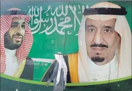  ?? Amr Nabil Associated Press ?? SAUDI CROWN PRINCE Mohammed bin Salman, left, on a banner in Jidda with his father, King Salman, is among U.S. allies accused of human rights abuses.