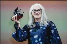  ??  ?? Jane Campion holds the Silver Lion Best Director award for ‘The Power Of The Dog.’ (AP)