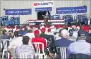  ?? JOHN MINCHILLO — THE ASSOCIATED PRESS ?? Audience members sit in chairs at socially distanced intervals as President Donald Trump speaks.