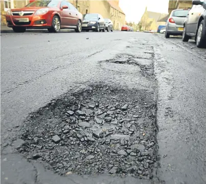  ?? Picture: Dougie Nicolson. ?? The Liberal Democrats are worried about the state of Fife’s roads – and want to increase charges at car parks to help pay for more repairs.