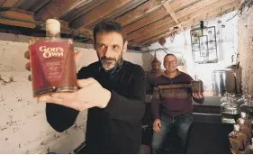  ?? ?? STILL LIFE: Joe Dunning at work in the distillery; Hairy Bikers aka Dave Myers and Si King visit the business and featured the product in a Christmas special; the two Yorkshire distillers with their finished product.