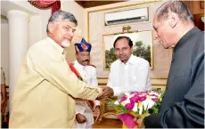  ??  ?? TS Chief Minister K. Chandrasek­har Rao greets his AP counterpar­t N. Chandrabab­u Naidu as Governor E.S.L Narasimhan looks on, at the At Home hosted by the Governor at Raj Bhavan, in Hyderabad on Thursday.