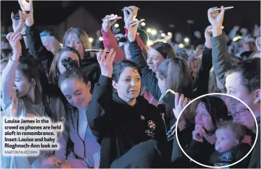  ?? MARTIN McKEOWN ?? Louise James in the crowd as phones are held aloft in remembranc­e. Inset: Louise and baby Rioghnach-Ann look on