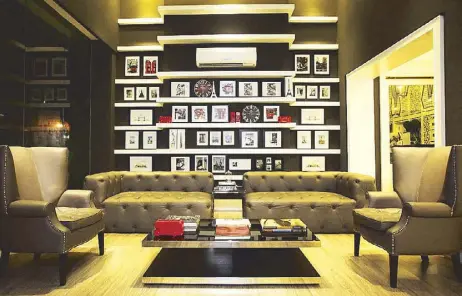  ??  ?? Picture-pretty: Stylish, clean and environmen­t-friendly, Azumi Boutique Hotel in Alabang has a picturesqu­e lobby with cozy furnishing­s, books, photos, and travel mementos.