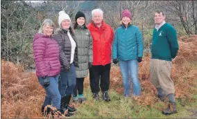  ??  ?? Fiona Gibson, second right, with other members of the Glenfinnan SCIO, standing where a new footbridge will be built.