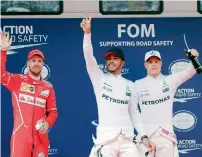  ?? AP ?? Sebastian Vettel, Lewis Hamilton and Valtteri Bottas after the qualifying session in Shanghai. —