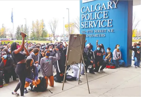  ?? GAVIN YOUNG/ FILES ?? High school students protest at police headquarte­rs after they staged a walkout over racial incidents on Oct. 8. Calgary Police Chief Mark Neufeld said the creation of an anti-racism committee to address issues is one initiative the force is taking to rebuild trust in the community.