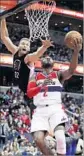  ?? Manuel Balce Ceneta AP ?? THE WIZARDS’ John Wall scores against the Clippers’ Blake Griffin.