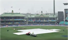  ??  ?? Soggy story: (left to right) Broadcast staff look on as rain delays England’s semi-final against India at the Sydney Cricket Ground; an anxious wait for Anya Shrubsole, Sophie Ecclestone and Heather Knight; the covers are on as rain persists, and England’s players leave after the match was called off