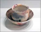  ?? ?? Ceramicist Susie Buykx has a range of ceramic pots on display at Benalla Art Gallery.