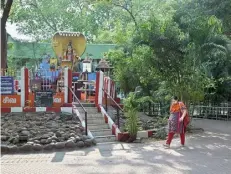  ?? AKHILA EASWARAN ?? A cool shelter: The Sivan Park, which boasts several species of trees, has a functional play area for children. Dominating the interior is a magnificen­t statue of Lord Shiva. The park’s lush greenery provides a refreshing escape from the urban hustle.