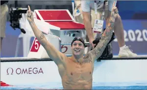  ?? MARTIN MEISSNER — THE ASSOCIATED PRESS ?? Team USA’s Caeleb Dressel celebrates his 100-meter freestyle victory at the Summer Olympics in Tokyo. Dressel’s win came after U.S. swimmer Bobby Finke won gold in the 800-meter freestyle.