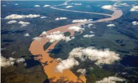  ?? ?? Clouds over the Rio Paraná Guazú, Argentina. Developers are filling the river’s delta with weekend retreats, luxury homes and gated communitie­s. Photograph: David Wall/Alamy