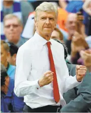  ?? IAN KINGTON/AFP PHOTO ?? Arsenal manager Arsene Wenger celebrates after beating Chelsea 2-1 in the FA Cup final on Saturday in London.