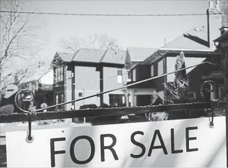  ?? GRAEME ROY THE CANADIAN PRESS ?? The Toronto Real Estate Board says home sales in the Greater Toronto Area in March fell 39.5 per cent compared with a year ago.