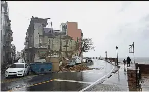  ??  ?? Structural harm: Buildings damaged after Hurricane Maria hit San Juan. — Reuters