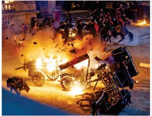  ?? ?? BLOWN APART: A cart explodes on the set of Napoleon, where Vanessa Kirby – right as Princess Margaret in The Crown – plays Josephine, clearly upset by the assassinat­ion attempt, as our exclusive pictures show