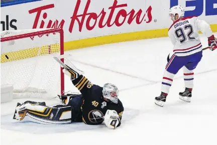  ?? JEFFREY T. BARNES/THE ASSOCIATED PRESS ?? Canadiens forward Jonathan Drouin puts the puck past Sabres goalie Robin Lehner to win 3-2 in a shootout in Montreal’s season opener. Drouin also set up Max Pacioretty’s first-period goal as they formed a solid trio with Brendan Gallagher.
