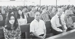  ??  ?? Yunus (second right) and the teachers seated in the church during the thanksgivi­ng mass.