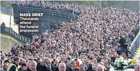  ??  ?? MASS GRIEF Thousands attend the funeral procession