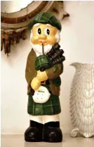  ??  ?? Whimsical: A Highland piper trinket at the Castle of Mey