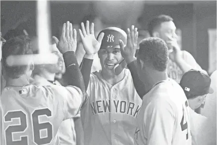  ??  ?? Right fielder Giancarlo Stanton hit two home runs in his debut with the Yankees on Thursday.