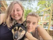  ?? SUBMITTED PHOTO ?? Kris Smith smiles alongside her daughter, Anna Smith, and their rescue pup, Zena, in downtown Kennett Square.