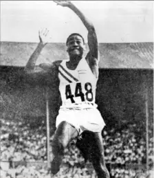  ?? Sen. John Heinz History Center ?? Herb Douglas takes flight in 1948 at the London Olympics.