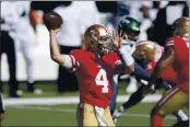  ?? BILL KOSTROUN — THE ASSOCIATED PRESS ?? The 49ers’ Nick Mullens throws a pass during the second half against the Jets on Sunday in East Rutherford, N.J.