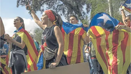  ?? Picture: Getty. ?? Students hold a protest against the violence that marred the referendum vote.