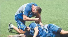  ?? Picture: AAP IMAGE ?? Team conditione­r Damian Mednis works with bowler Mitchell Johnson during his time with the Aussie team.