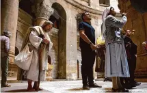  ?? Alexi J. Rosenfeld/Getty Images ?? Carl James Joseph, dressed as Jesus, prays the the Church of the Holy Sepulchre on Good Friday in Jerusalem.