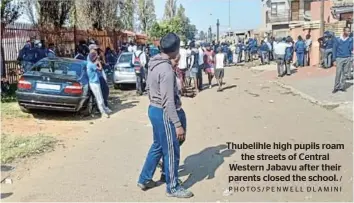  ?? / PHOTOS/PENWELL DLAMINI ?? Thubelihle high pupils roam the streets of Central Western Jabavu after their parents closed the school.