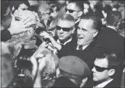  ?? STEPHEN CROWLEY/ NEW YORK TIMES ?? Republican candidate Mitt Romney greets supporters Monday during a campaign rally in Lynchburg, Va.