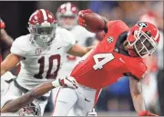  ?? / AP-John Bazemore ?? Alabama’s Henry Ruggs III (11) tackles Georgia wide receiver Mecole Hardman (4) on a punt return during Saturday’s game in Atlanta.