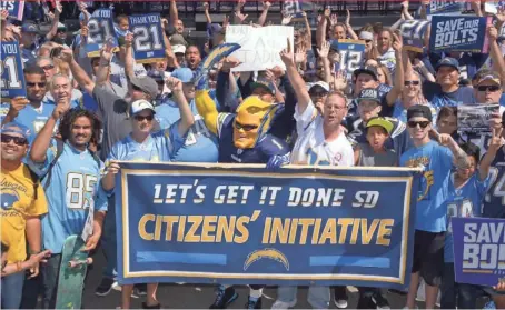  ?? KIRBY LEE, USA TODAY SPORTS ?? Dan Jauregui, aka Boltman, and other Chargers fans back a downtown stadium. A proposal to tax visitors for it faces a vote.