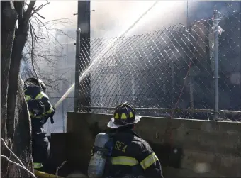  ?? GLENN PRESTON PHOTO ?? Firefighte­rs kept pumping water at a 5-alarm fire in Chelsea Friday.