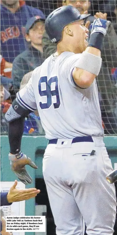  ?? GETTY ?? Aaron Judge celebrates his homer with Luke Voit as Yankees bash Red Sox on Friday night. If Bombers beat A’s in wild-card game, they’ll see Boston again in the ALDS.