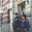  ?? BRYAN THOMAS, GETTY IMAGES ?? Police stand in front of Craig Spencer’s apartment building Saturday in New York City.