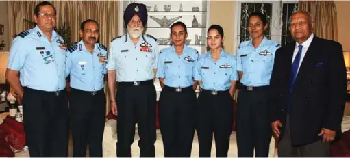  ??  ?? THE FIRST THREE WOMEN FIGHTER PILOTS CALL ON MARSHAL OF THE INDIAN AIR FORCE ARJAN SINGH DFC