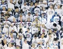  ?? JASON HALSTEAD/GETTY IMAGES ?? The Jets’ playoff run has put Winnipeg and its white-clad fans in the national spotlight.